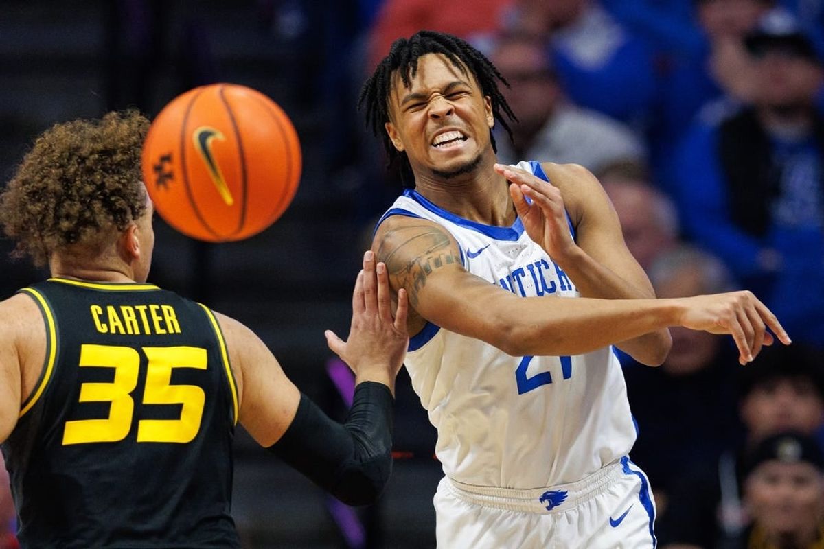 Jan 9, 2024; Lexington, Kentucky, USA; Kentucky Wildcats guard D.J. Wagner (21) passes the ball during the first half against the Missouri Tigers at Rupp Arena at Central Bank Center.