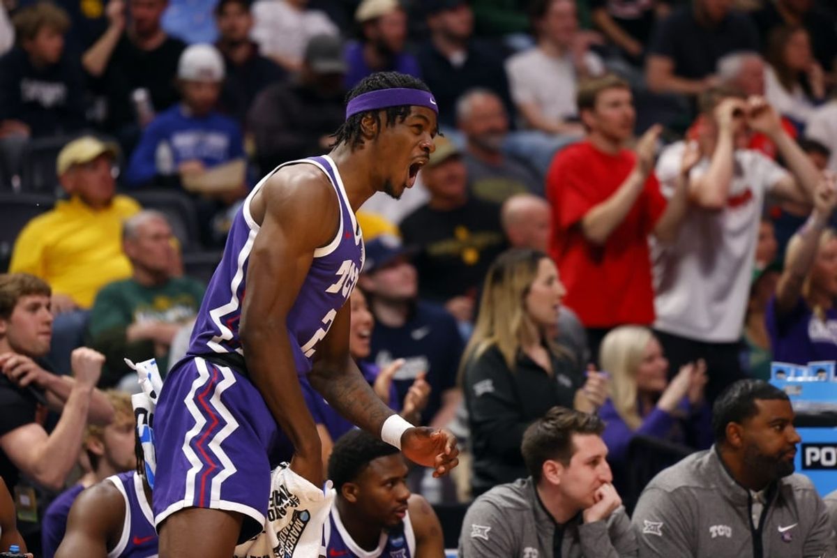 Mar 19, 2023; Denver, CO, USA; TCU Horned Frogs forward Emanuel Miller (2) celebrates on the bench in the first half against the Gonzaga Bulldogs at Ball Arena.