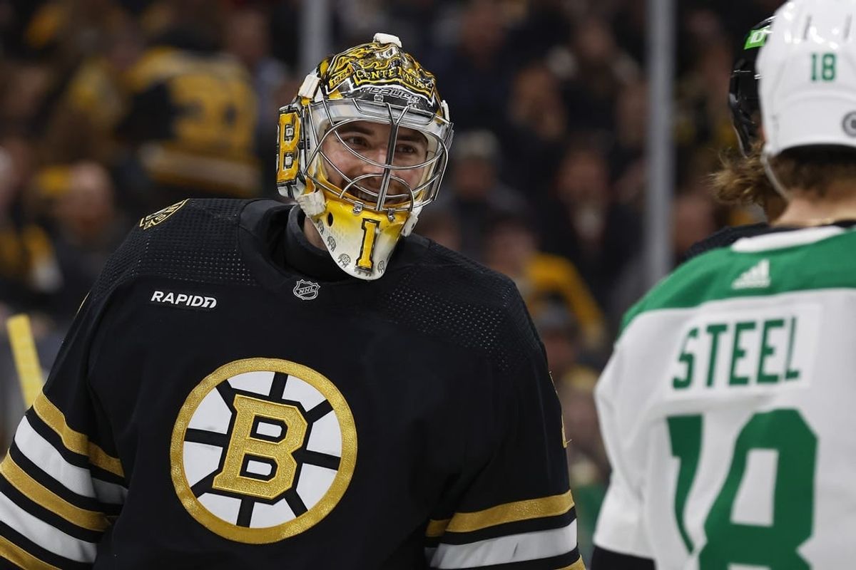 Feb 19, 2024; Boston, Massachusetts, USA; Boston Bruins goaltender Jeremy Swayman (1) smiles at Dallas Stars center Sam Steel (18) during the second period at TD Garden.