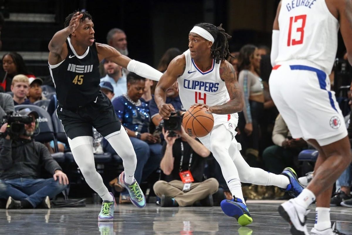 Feb 23, 2024; Memphis, Tennessee, USA; Los Angeles Clippers guard Terance Mann (14) drives to the basket as Memphis Grizzlies forward GG Jackson (45) defends during the first half at FedExForum.