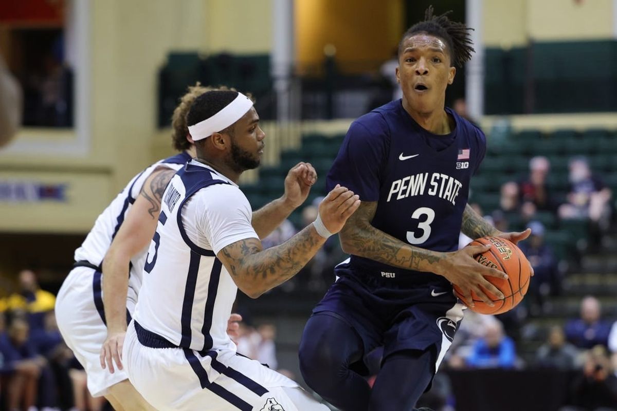 Nov 24, 2023; Kissimmee, FL, USA;  Penn State Nittany Lions guard Nick Kern Jr. (3) looks to pass the the ball guarded y Butler Bulldogs guard Posh Alexander (5) in the first half during the ESPN Events Invitational Consolation game 1 at State Farm Field House.