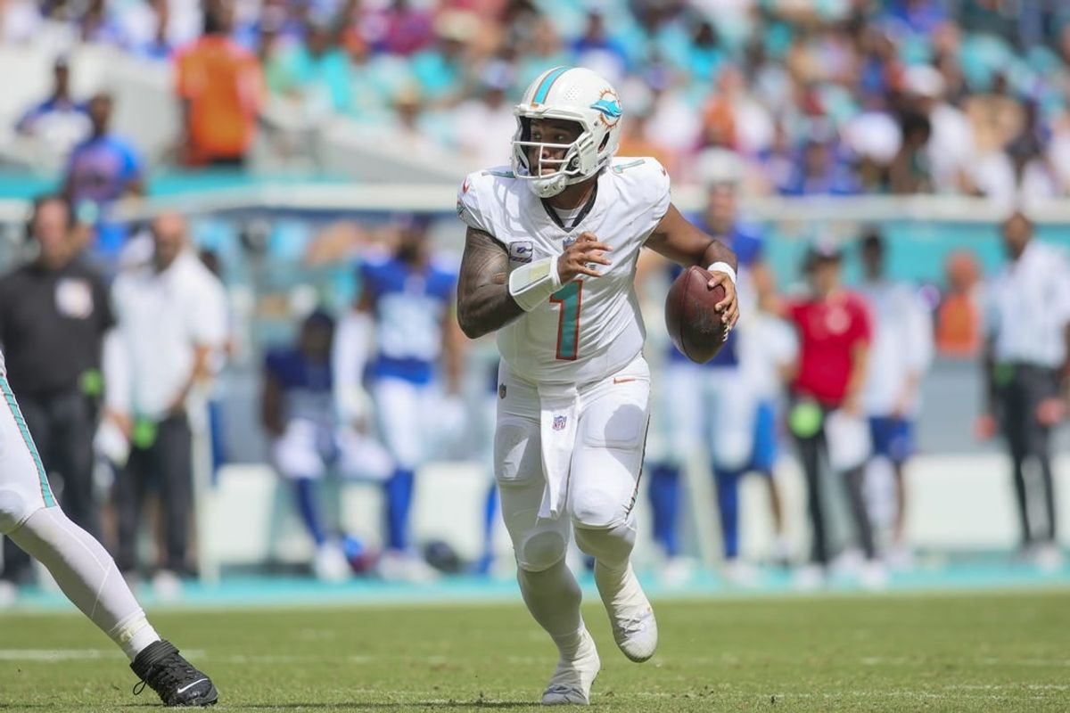 Oct 8, 2023; Miami Gardens, Florida, USA; Miami Dolphins quarterback Tua Tagovailoa (1) run with the football against the New York Giants during the second quarter at Hard Rock Stadium.