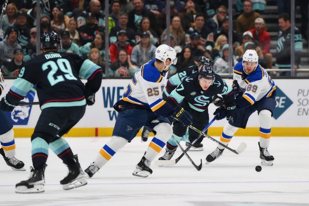 Jan 26, 2024; Seattle, Washington, USA; St. Louis Blues center Jordan Kyrou (25) and Seattle Kraken center Yanni Gourde (37) and St. Louis Blues left wing Pavel Buchnevich (89) chase the puck during the third period at Climate Pledge Arena.