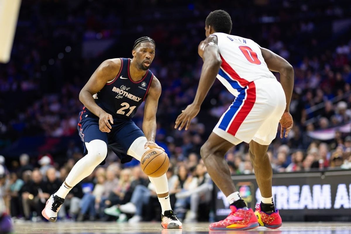 Apr 9, 2024; Philadelphia, Pennsylvania, USA; Philadelphia 76ers center Joel Embiid (21) dribbles the ball against Detroit Pistons center Jalen Duren (0) during the second quarter at Wells Fargo Center.