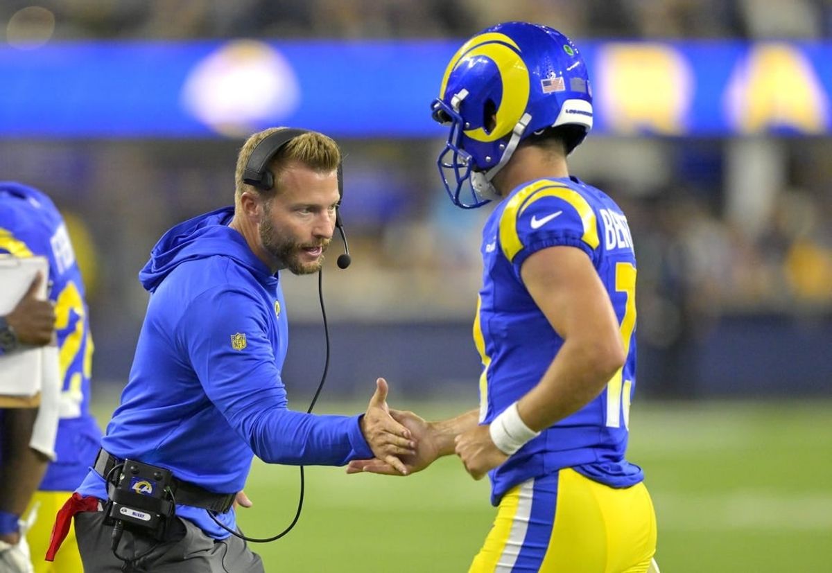 Aug 12, 2023; Inglewood, California, USA;   Los Angeles Rams coach Sean McVay congratulates quarterback Stetson Bennett (13) after a touchdown in the second half against the Los Angeles Chargers at SoFi Stadium.