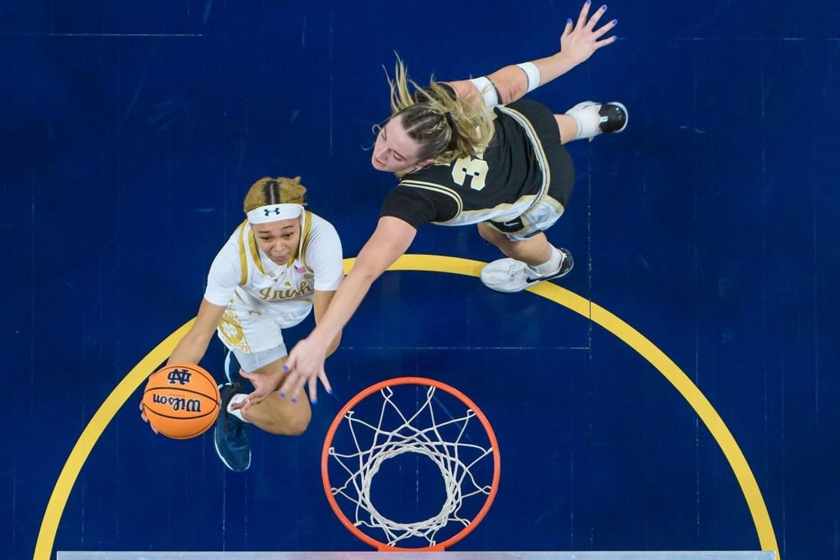 Dec 17, 2023; South Bend, Indiana, USA; Notre Dame Fighting Irish guard Hannah Hidalgo (3) goes up for a shot as Purdue Boilermakers forward Caitlyn Harper (34) defends in the first half at the Purcell Pavilion.