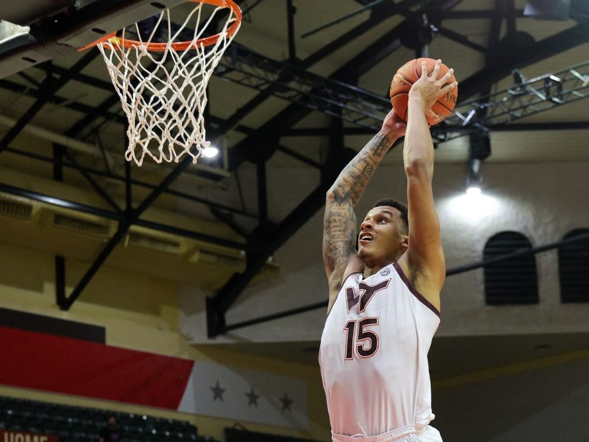 Nov 23, 2023; Kissimmee, FL, USA;  Virginia Tech Hokies center Lynn Kidd (15) dunks the ball against the Boise State Broncos in the second half during the ESPN Events Invitational at State Farm Field House.