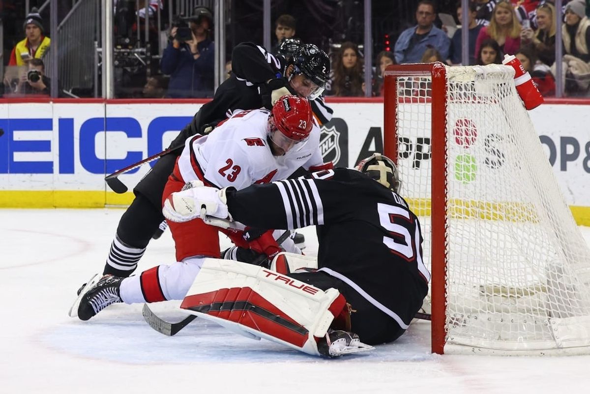 Mar 9, 2024; Newark, New Jersey, USA; New Jersey Devils goaltender Nico Daws (50) makes a save against the Carolina Hurricanes during the first period at Prudential Center.