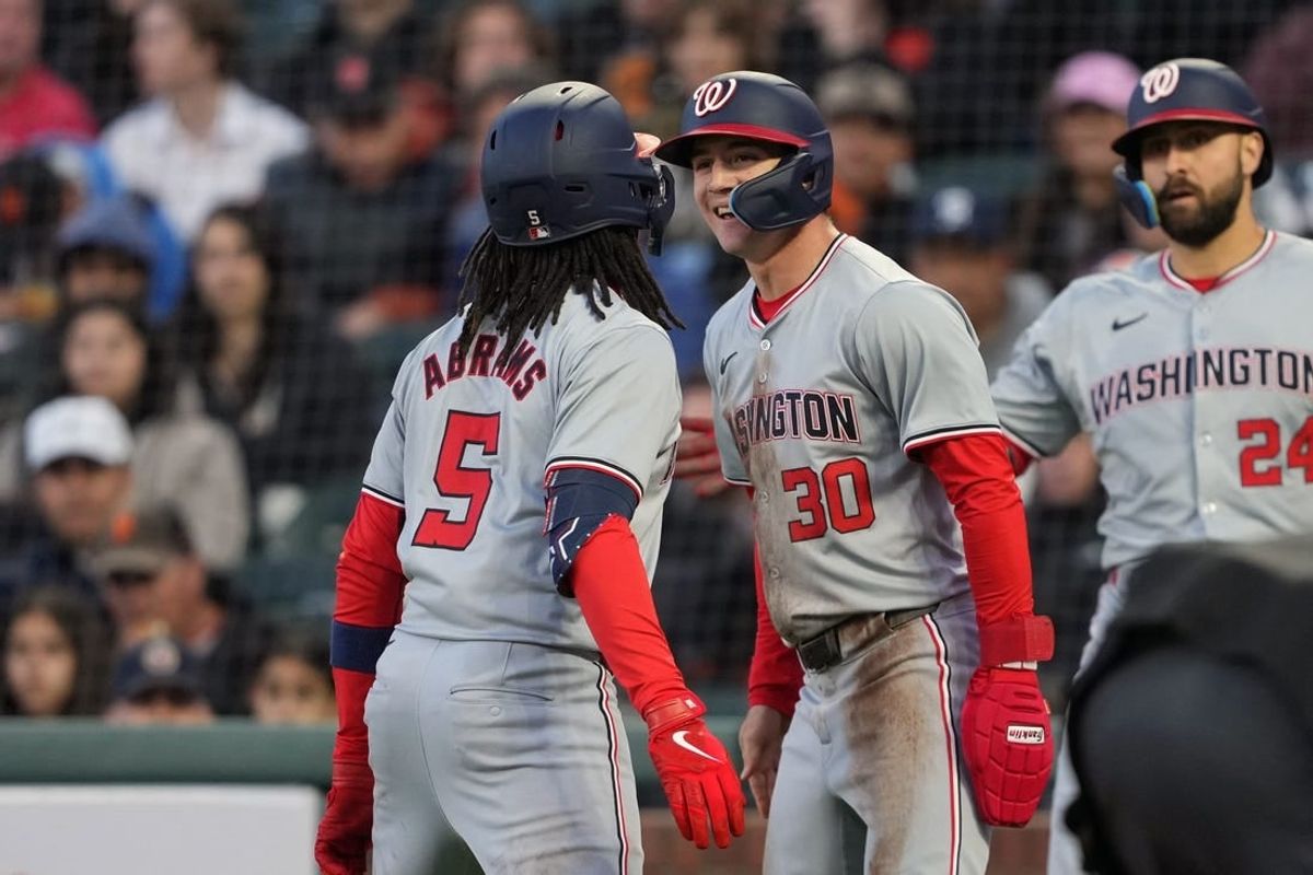 Apr 9, 2024; San Francisco, California, USA; Washington Nationals shortstop CJ Abrams (5) celebrates with center fielder Jacob Young (30) after hitting a home run against the San Francisco Giants during the third inning at Oracle Park.