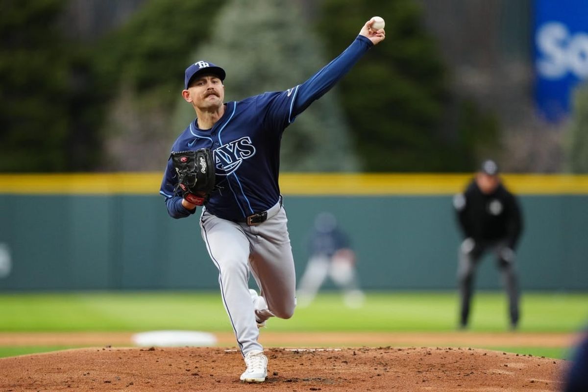 Apr 6, 2024; Denver, Colorado, USA; Tampa Bay Rays pitcher Tyler Alexander (14) delivers a pitch in the first inning against the Colorado Rockies at Coors Field.