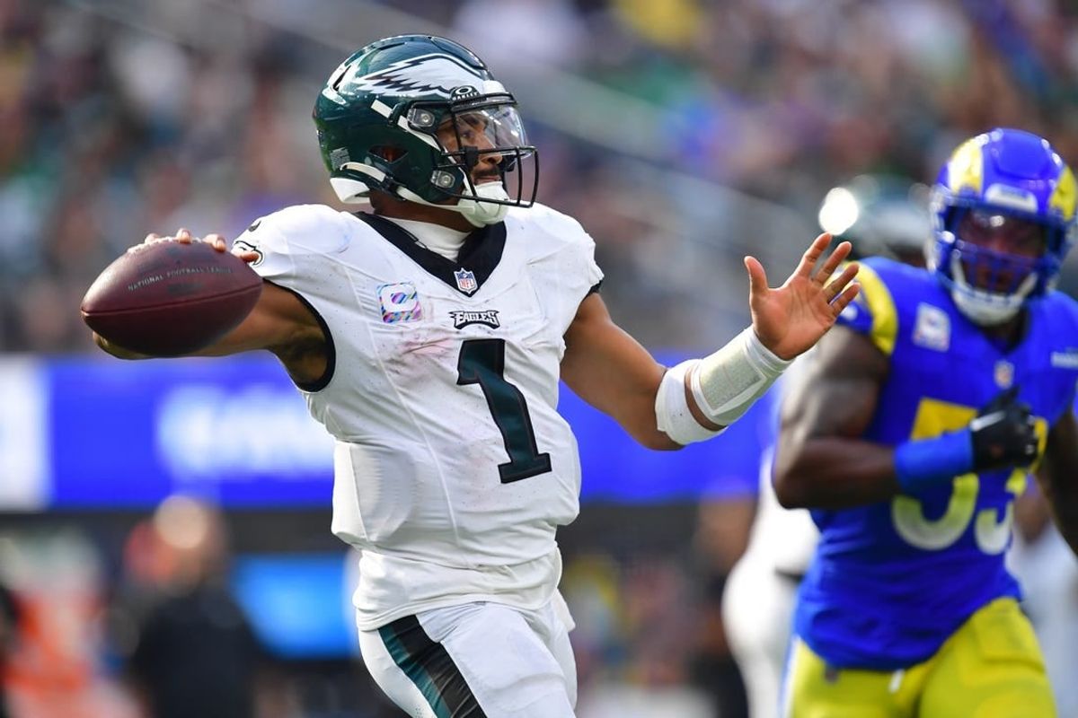 Oct 8, 2023; Inglewood, California, USA; Philadelphia Eagles quarterback Jalen Hurts (1) throws ahead of Los Angeles Rams linebacker Ernest Jones (53) during the second half at SoFi Stadium.