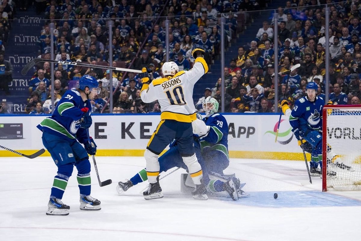 Apr 23, 2024; Vancouver, British Columbia, CAN; Vancouver Canucks forward Nils Hoglander (21) and forward Elias Pettersson (40) and goalie Casey DeSmith (29) and defenseman Quinn Hughes (43) react as Nashville Predators forward Colton Sissons (10) celebrate his goal  during the second period in game two of the first round of the 2024 Stanley Cup Playoffs at Rogers Arena.