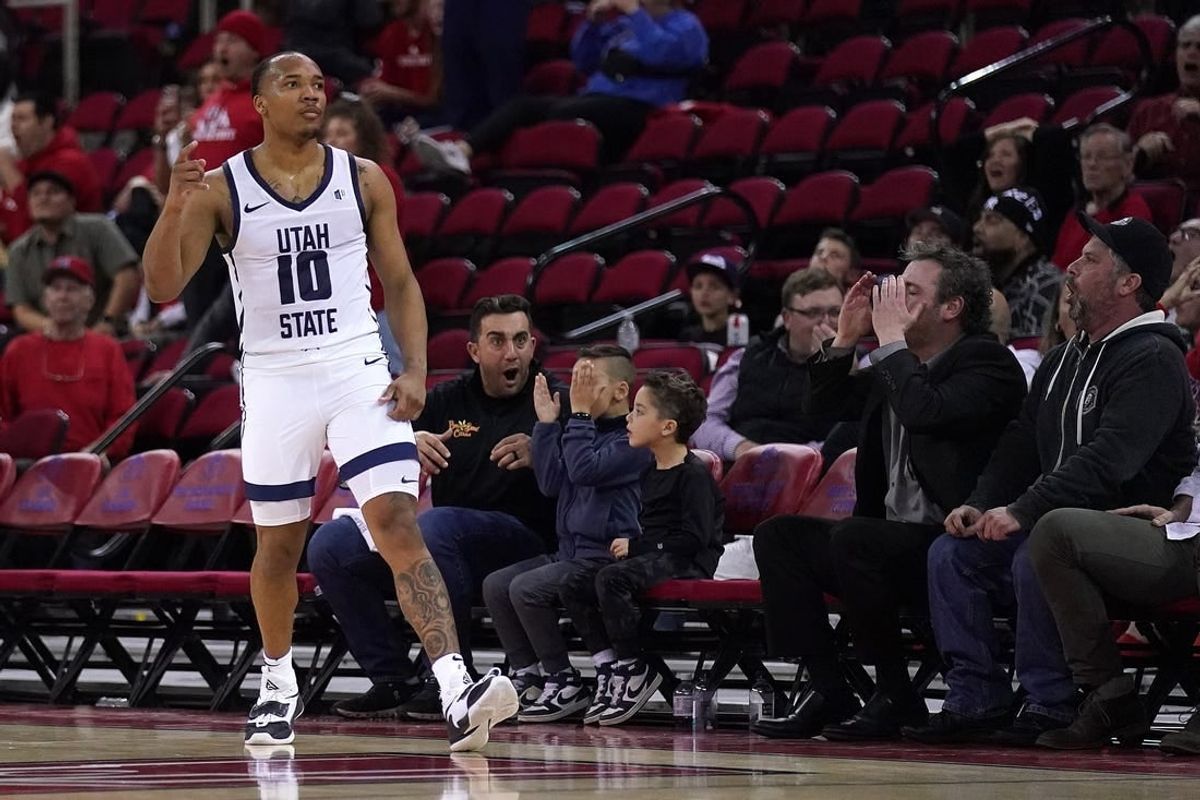 Feb 27, 2024; Fresno, California, USA; Utah State Aggies guard Darius Brown II (10) reacts after making a three point shot against the Fresno State Bulldogs with under two second remaining in the second half at the Save Mart Center.