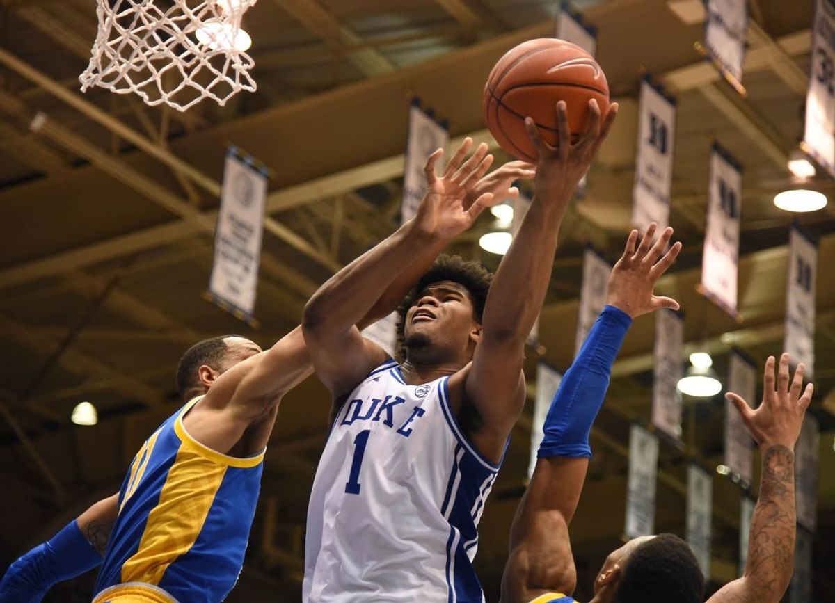 Jan 28, 2020; Durham, North Carolina, USA; Duke Blue Devils center Vernon Carey Jr. (1) shoots over Pitt Panthers forward Terrell Brown (21) during the second half at Cameron Indoor Stadium.