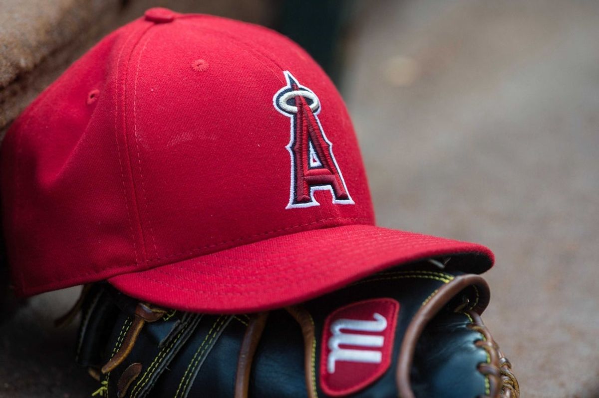 Jul 3, 2015; Arlington, TX, USA; A view of a Los Angeles Angels baseball hat and glove and logo before the game between the Texas Rangers and the Los Angeles Angels at Globe Life Park in Arlington. The Angels defeated the Rangers 8-2. Mandatory Credit: Jerome Miron-Imagn Images