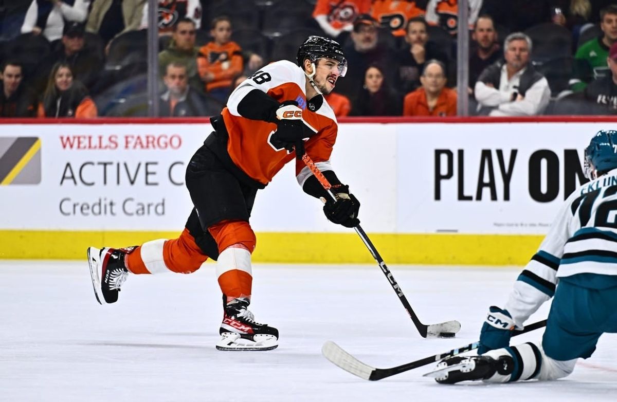 Mar 12, 2024; Philadelphia, Pennsylvania, USA; Philadelphia Flyers center Morgan Frost (48) shoots against the San Jose Sharks in the third period at Wells Fargo Center.