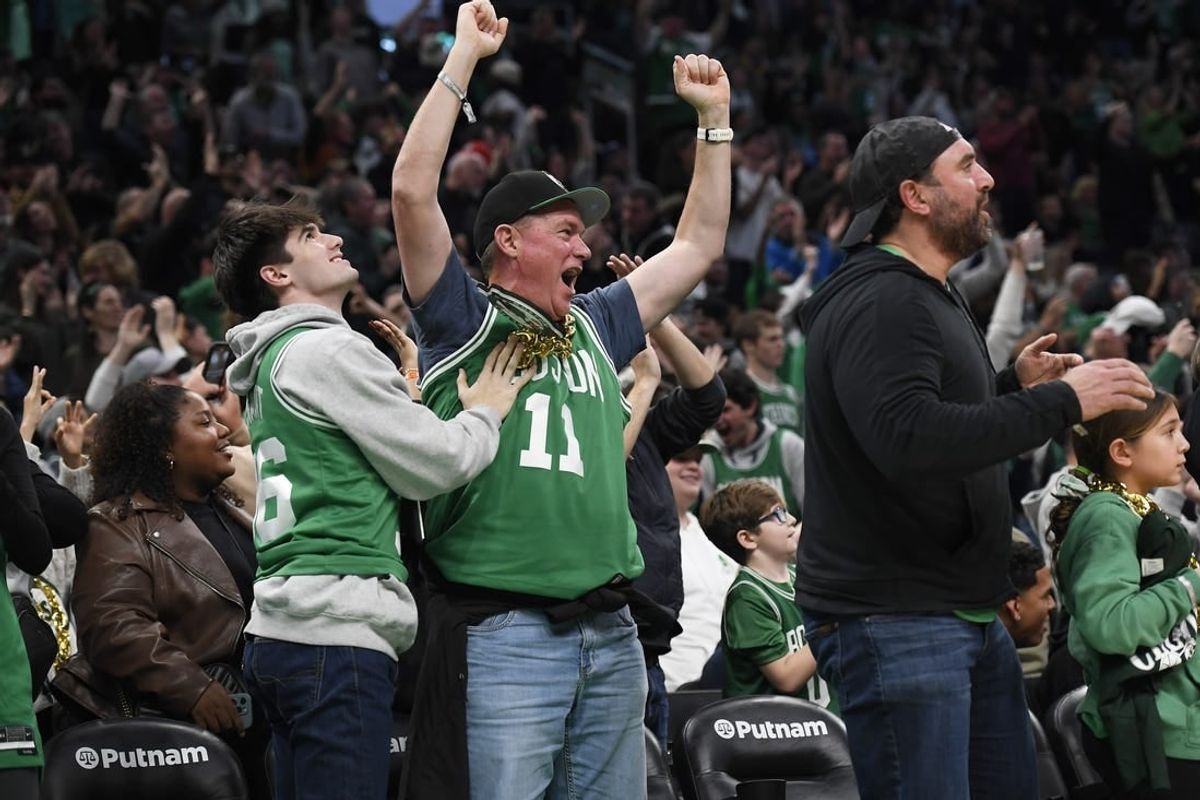 Dec 28, 2023; Boston, Massachusetts, USA;  Boston Celtics fans cheer during the second half against the Detroit Pistons at TD Garden.
