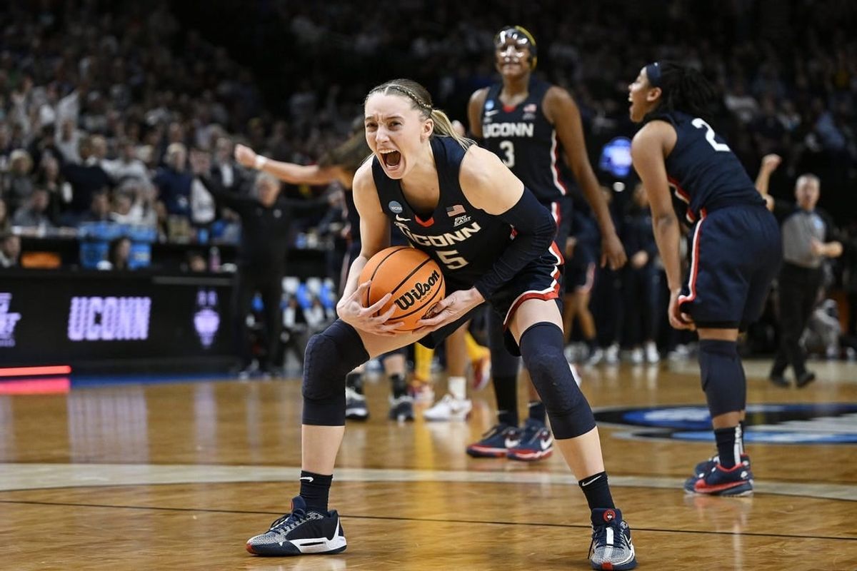 UConn Huskies guard Paige Bueckers (5) celebrates after beating the USC Trojans in the finals of the Portland Regional of the NCAA Tournament at the Moda Center.