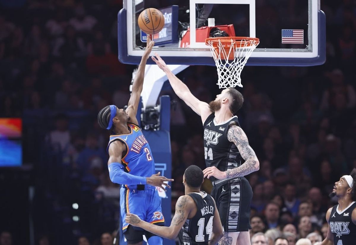 Apr 10, 2024; Oklahoma City, Oklahoma, USA; Oklahoma City Thunder guard Shai Gilgeous-Alexander (2) shoots as San Antonio Spurs forward Sandro Mamukelashvili (54) defends during the second quarter at Paycom Center.
