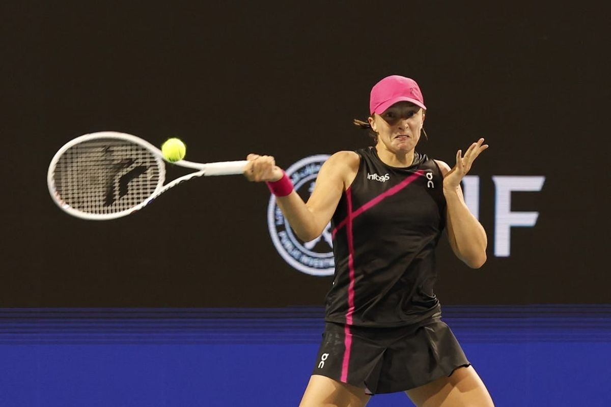 Mar 24, 2024; Miami Gardens, FL, USA; Iga Swiatek (POL) hits a forehand against Linda Noskova (CZE) (not pictured) on day seven of the Miami Open at Hard Rock Stadium.