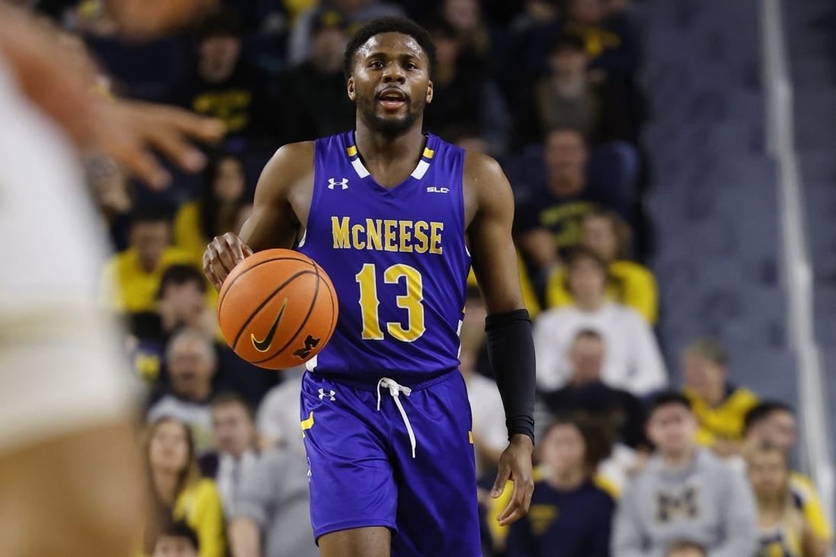 Dec 29, 2023; Ann Arbor, Michigan, USA;  McNeese State Cowboys guard Shahada Wells (13) dribbles in the second half against the Michigan Wolverines at Crisler Center.