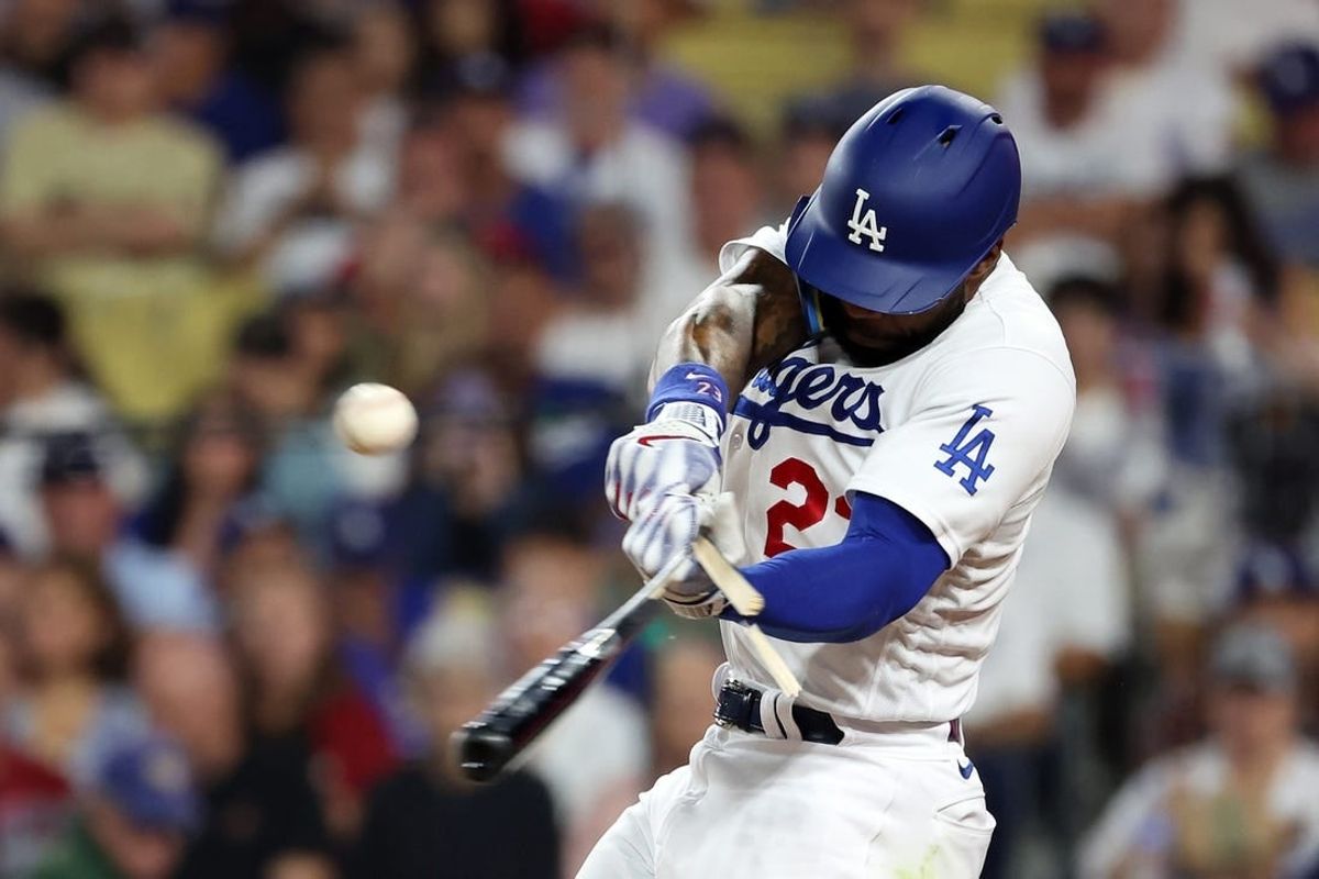 Oct 7, 2023; Los Angeles, California, USA; Los Angeles Dodgers right fielder Jason Heyward (23) breaks a bat on a fly ball against the Arizona Diamondbacks during the second inning for game one of the NLDS for the 2023 MLB playoffs at Dodger Stadium.