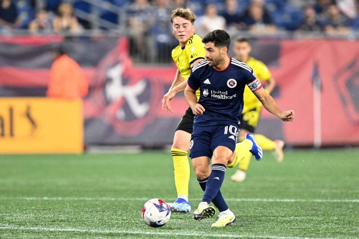 Oct 4, 2023; Foxborough, Massachusetts, USA; New England Revolution midfielder Carles Gil (10) passes the ball against the Columbus Crew during the first half at Gillette Stadium.