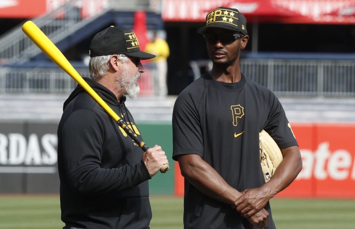 Apr 8, 2024; Pittsburgh, Pennsylvania, USA;  Pittsburgh Pirates manager Derek Shelton (left) and Pittsburgh Pirates outfielder Michael A. Taylor (18) talk on the field before the game against the Detroit Tigers at PNC Park.