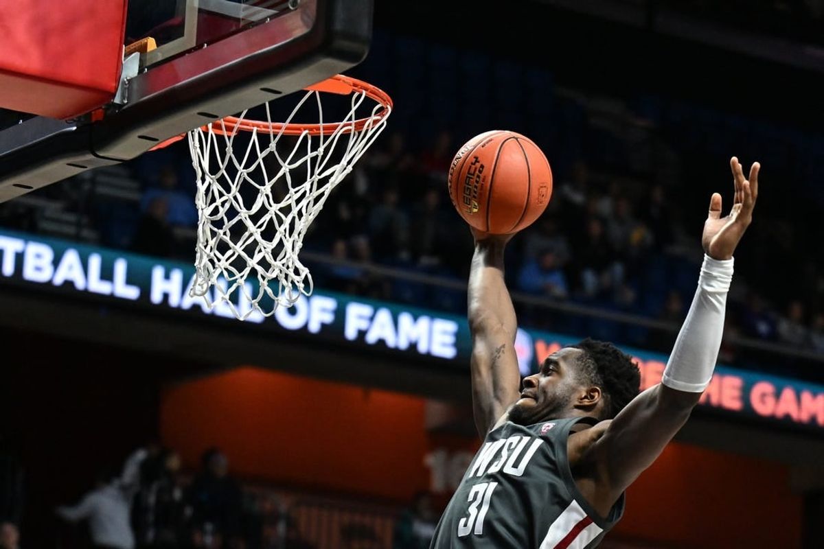 Nov 18, 2023; Uncasville, CT, USA; Washington State Cougars guard Kymany Houinsou (31) rebounds the ball during the second half against Mississippi State Bulldogs at Mohegan Sun Arena.