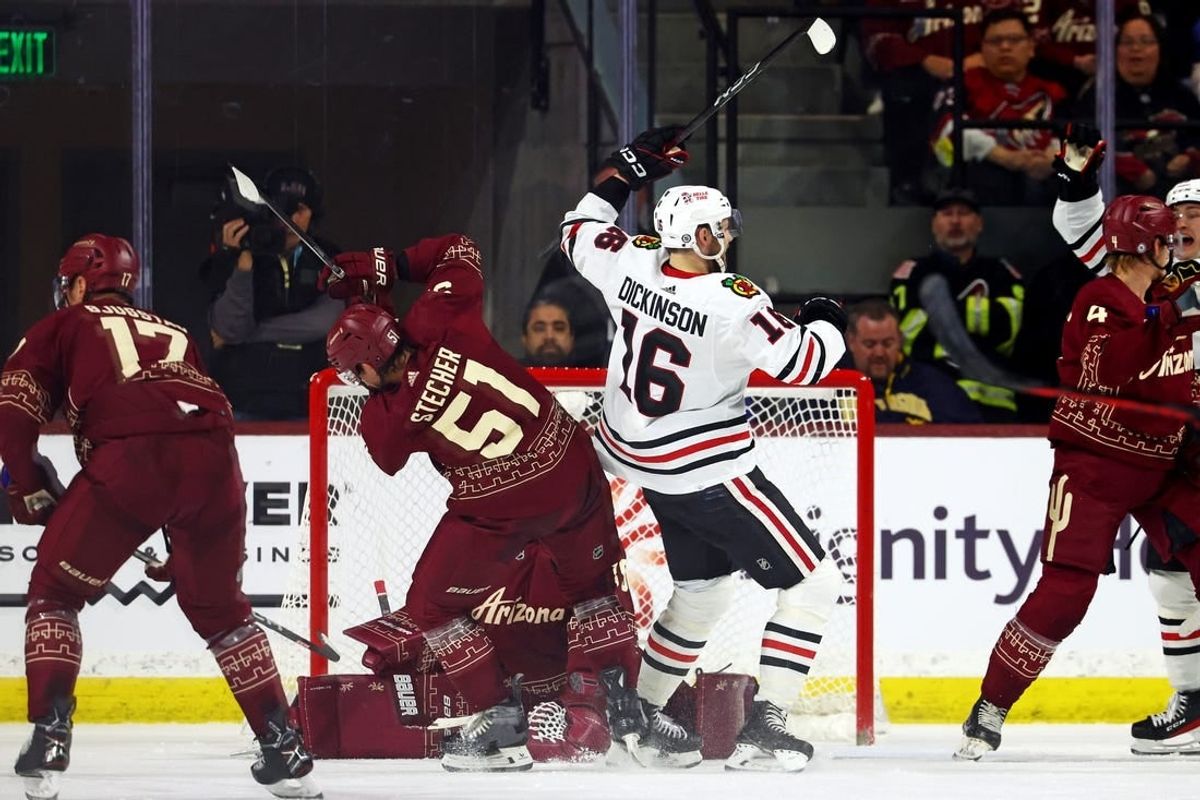 Mar 5, 2024; Tempe, Arizona, USA;  Chicago Blackhawks center Jason Dickinson (16) celebrates after scoring a goal during the second period of the game against the Arizona Coyotes at Mullett Arena.