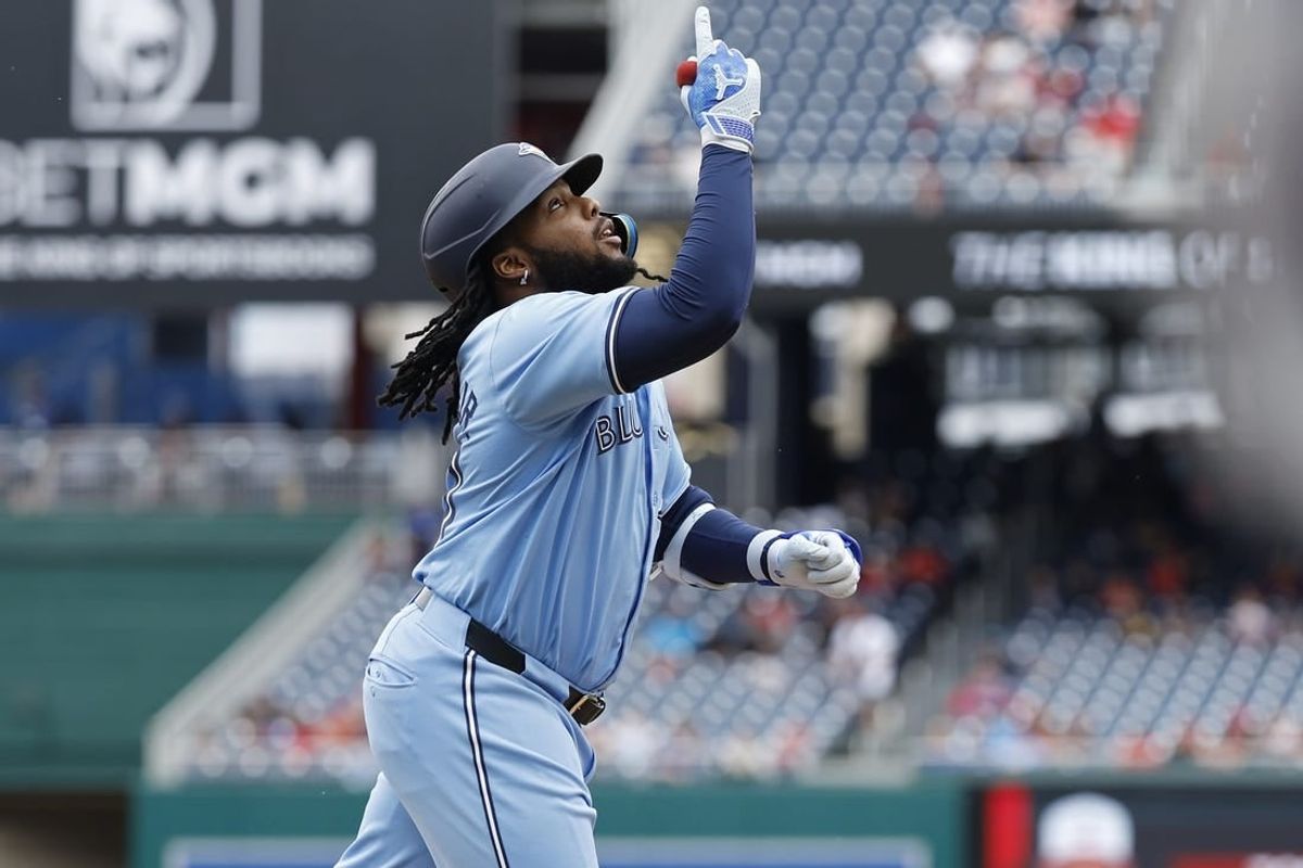 May 5, 2024; Washington, District of Columbia, USA; Toronto Blue Jays first baseman Vladimir Guerrero Jr. (27) celebrates while rounding the bases after hitting a grand slam against the Washington Nationals during the second inning at Nationals Park.