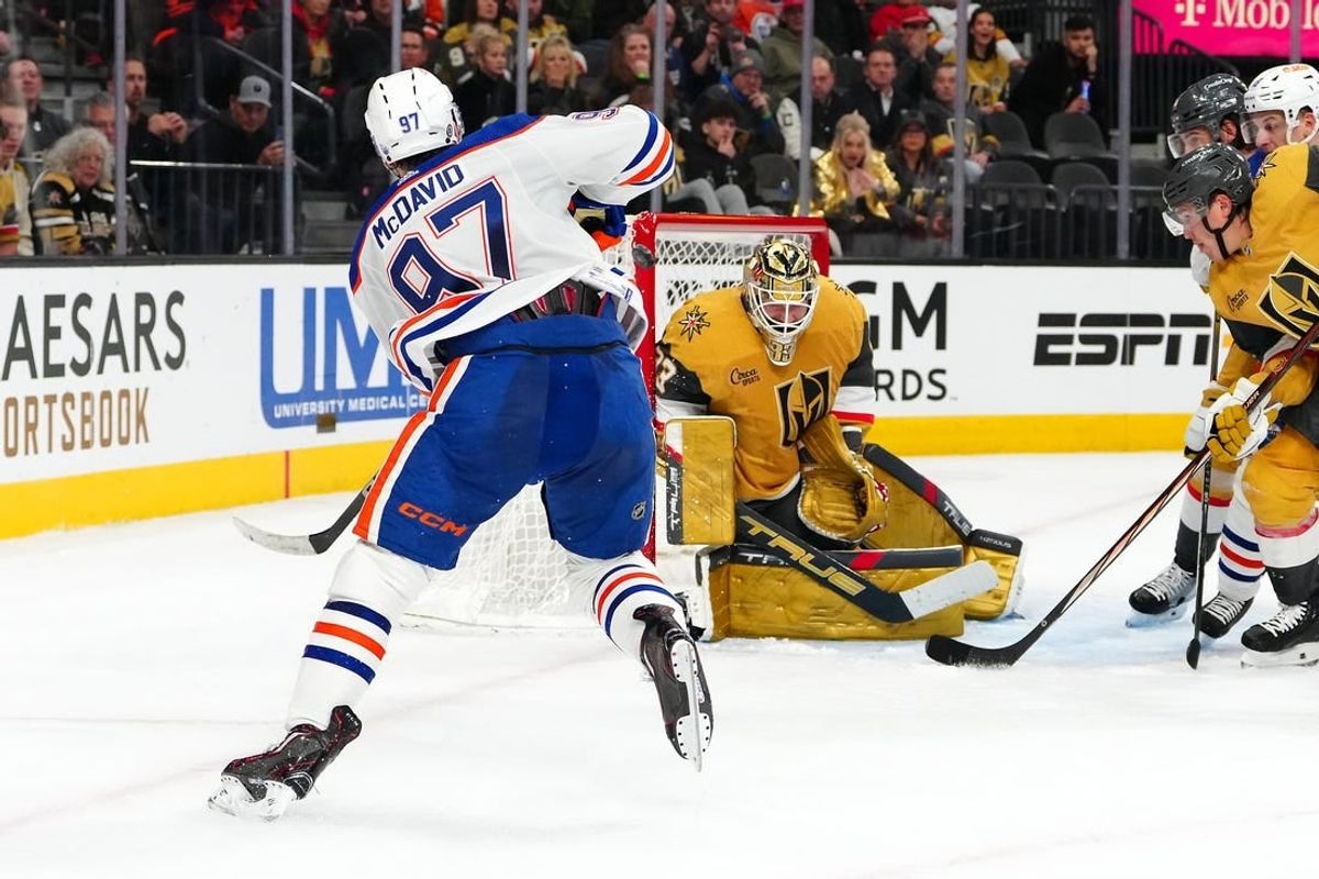 Feb 6, 2024; Las Vegas, Nevada, USA; Edmonton Oilers center Connor McDavid (97) hits the post behind Vegas Golden Knights goaltender Adin Hill (33) during the second period at T-Mobile Arena.