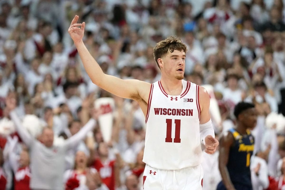 Dec 2, 2023; Madison, Wisconsin, USA;  Wisconsin Badgers guard Max Klesmit (11) celebrates after scoring a three point basket against the Marquette Golden Eagles during the first half at the Kohl Center.
