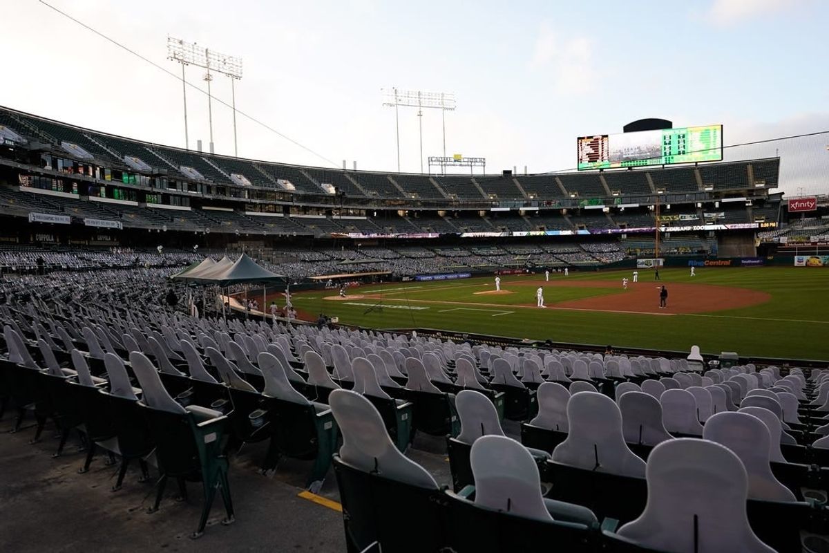 General view of the lower bowl seating at Oakland Coliseum with cardboard cutout fans during a 2020 Oakland Athletics game.