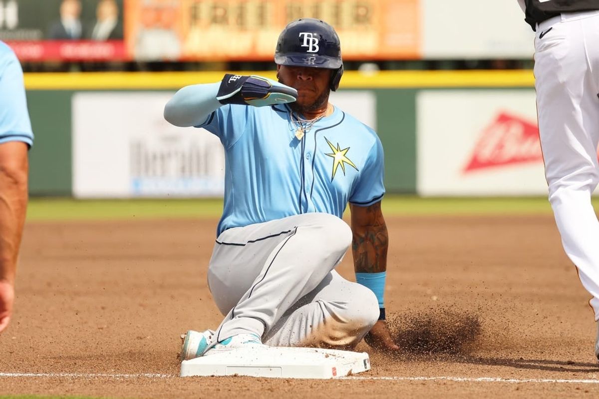 Mar 1, 2024; Bradenton, Florida, USA;  Tampa Bay Rays designated hitter Harold Ramirez (43) slides safely into third base against the Pittsburgh Pirates during the third inning at LECOM Park.