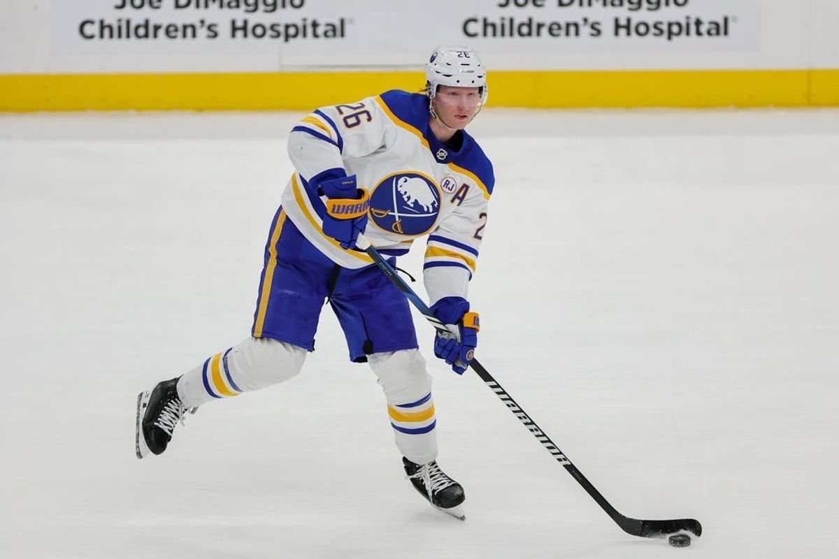 Feb 27, 2024; Sunrise, Florida, USA; Buffalo Sabres defenseman Rasmus Dahlin (26) moves the puck against the Florida Panthers during the first period at Amerant Bank Arena.