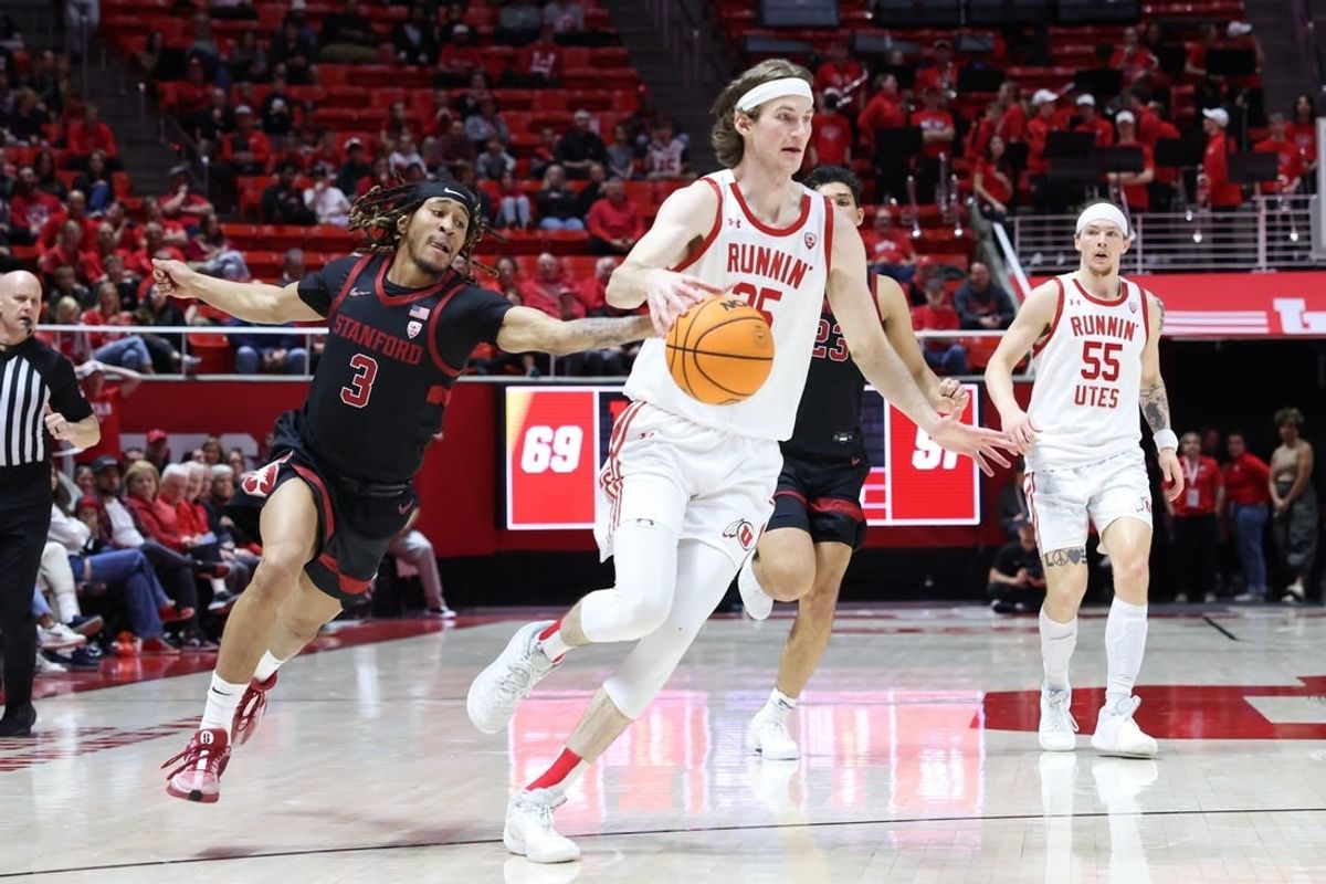 Feb 29, 2024; Salt Lake City, Utah, USA; Stanford Cardinal guard Kanaan Carlyle (3) knocks the ball away from Utah Utes center Branden Carlson (35) during the second half at Jon M. Huntsman Center.