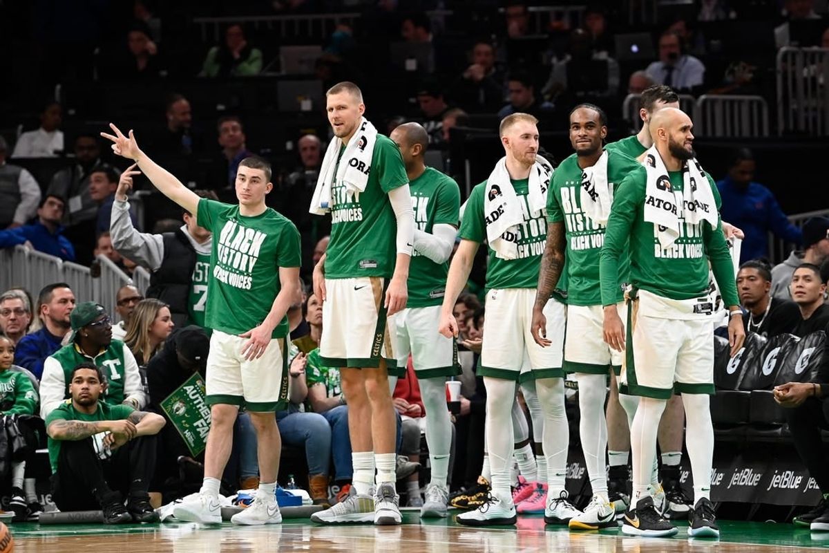 Feb 4, 2024; Boston, Massachusetts, USA; the Celtics bench reacts after a score against the Memphis Grizzlies during the second half at TD Garden.