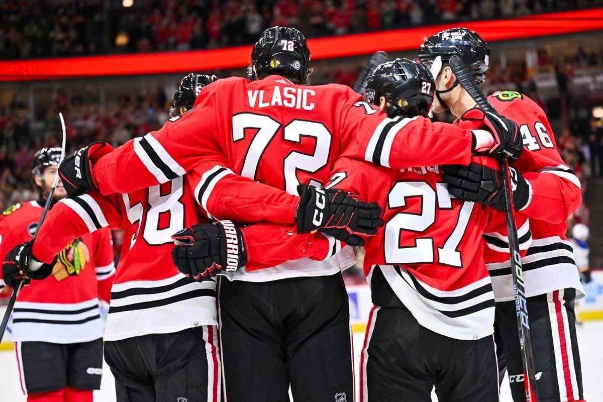 Dec 9, 2023; Chicago, Illinois, USA; Chicago Blackhawks defenseman Alex Vlasic (72) celebrates with teammates after scoring a goal in the first period against the St. Louis Blues at United Center.