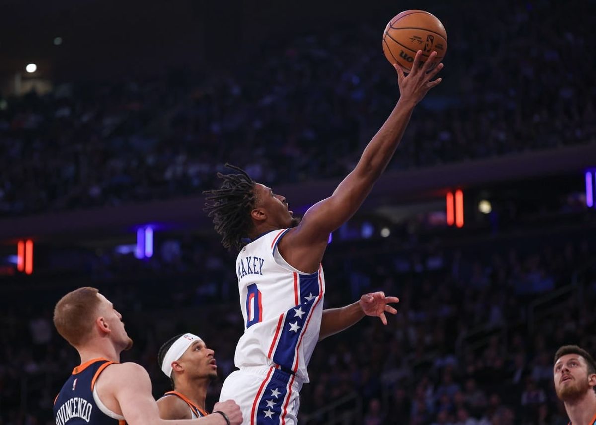 Mar 12, 2024; New York, New York, USA; Philadelphia 76ers guard Tyrese Maxey (0) shoots the ball against the New York Knicks New York Knicks guard Donte DiVincenzo (0) during the first quarter at Madison Square Garden.