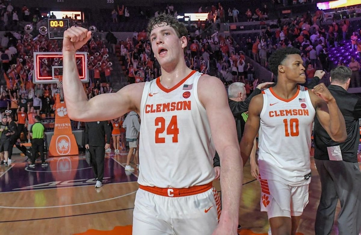 Feb 27, 2024; Clemson, South Carolina, USA; Clemson junior forward PJ Hall (24) and RJ Godfrey (10) celebrate after the Tigers beat Pitt 69-62 at Littlejohn Coliseum.
