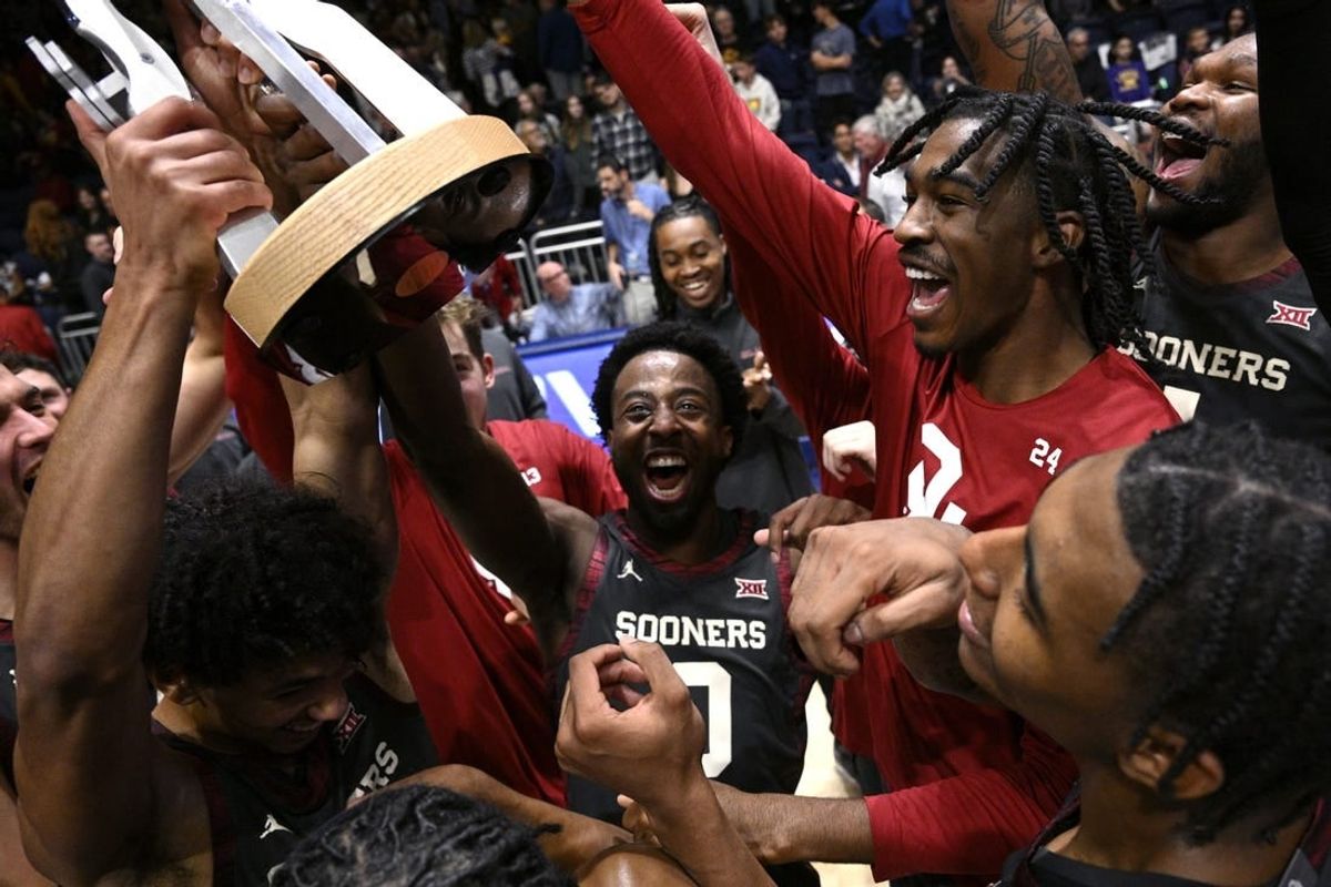 Nov 24, 2023; La Jolla, California, USA; Oklahoma Sooners players celebrate with the championship trophy after defeating USC Trojans at LionTree Arena.