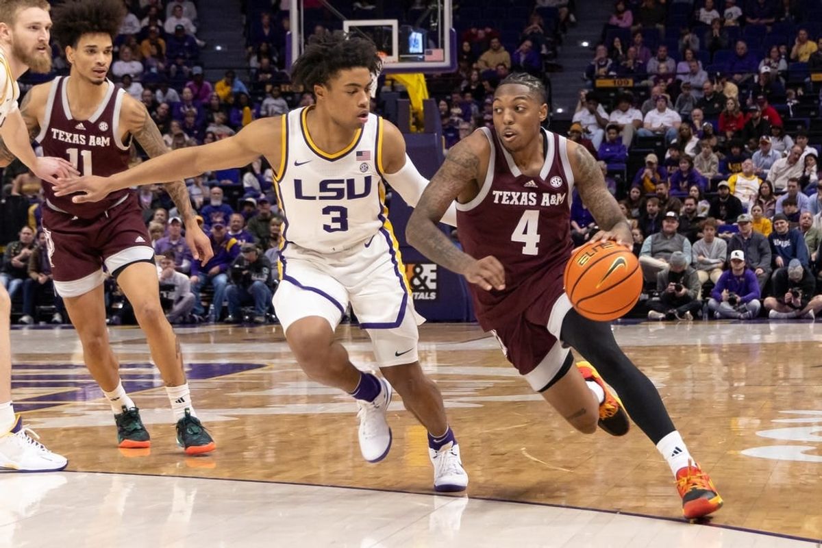 Jan 20, 2024; Baton Rouge, Louisiana, USA;  Texas A&M Aggies guard Wade Taylor IV (4) dribbles against LSU Tigers guard Jalen Cook (3) during the second half at Pete Maravich Assembly Center.