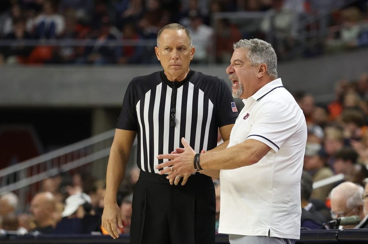Dec 17, 2023; Auburn, Alabama, USA;  Auburn Tigers head coach Bruce Pearl talks to a game official during the second half against the USC Trojans at Neville Arena.