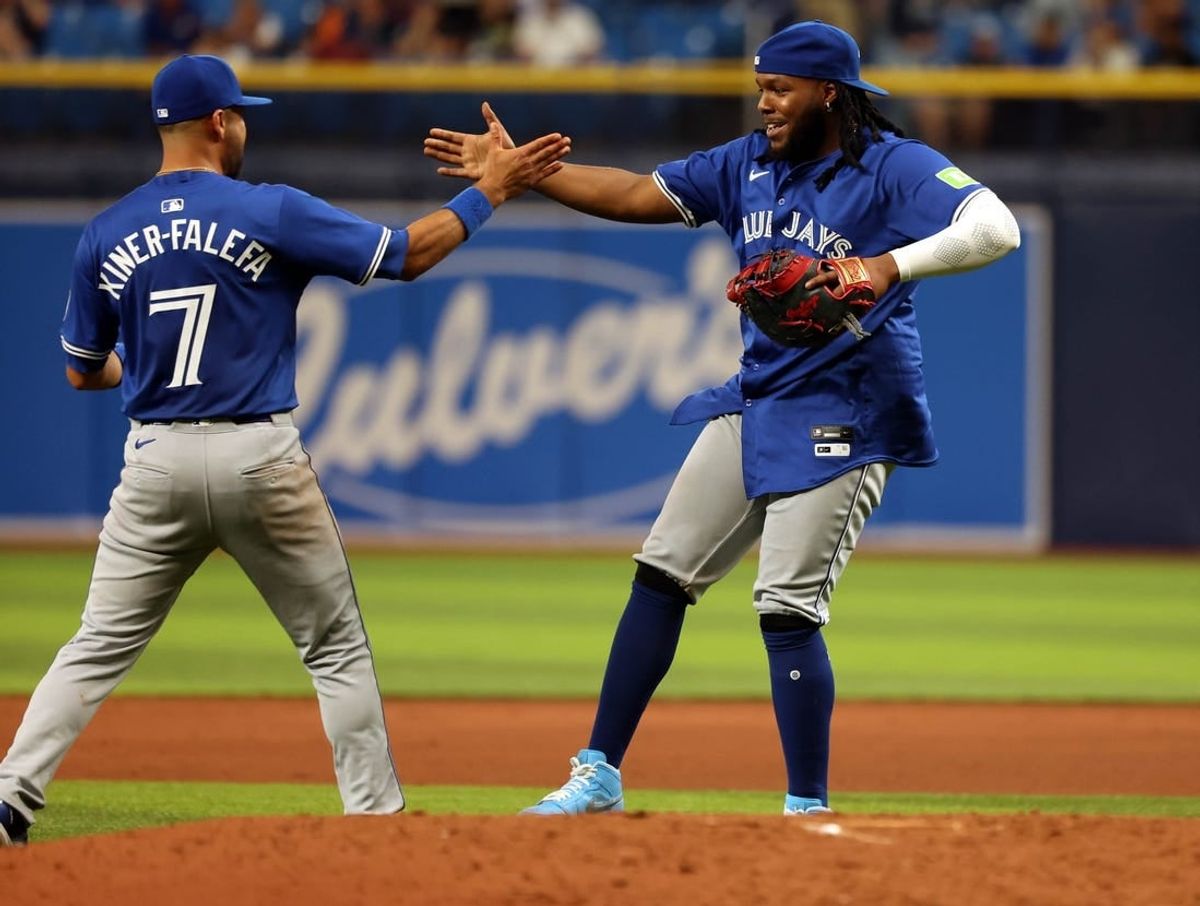 Mar 28, 2024; St. Petersburg, Florida, USA;Toronto Blue Jays first baseman Vladimir Guerrero Jr. (27) and first baseman Vladimir Guerrero Jr. (27) celebrates after they beat the Tampa Bay Rays at Tropicana Field.