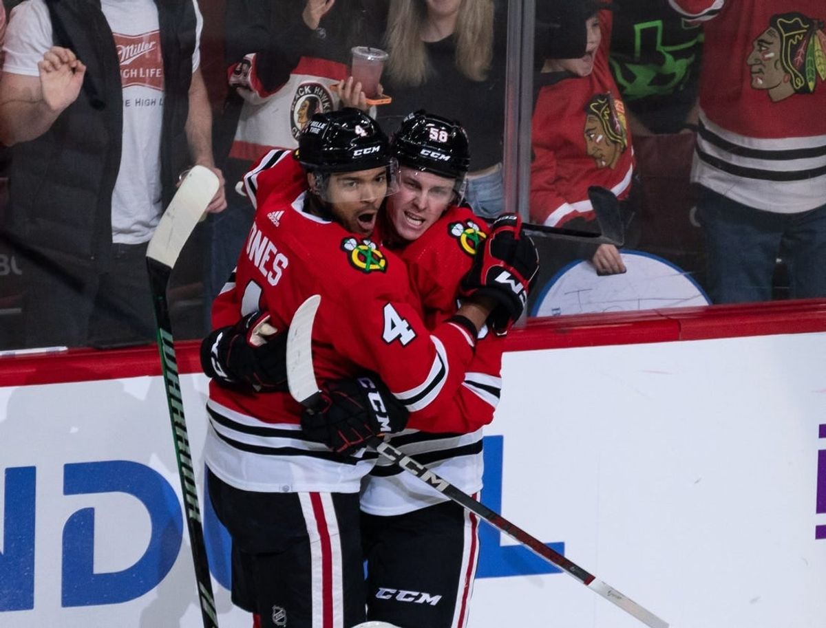 Apr 6, 2024; Chicago, Illinois, USA; Chicago Blackhawks defenseman Seth Jones (4) celebrates after scoring a goal against the Dallas Stars during the second period at United Center.