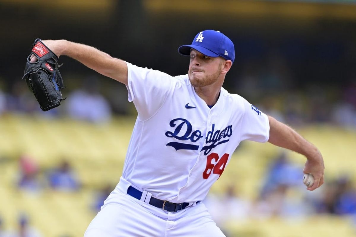 Aug 19, 2023; Los Angeles, California, USA;  Los Angeles Dodgers pitcher Caleb Ferguson (64) throws to the plate in the first inning against the Miami Marlins at Dodger Stadium.