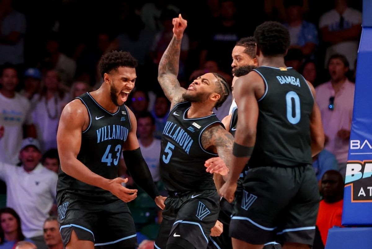 Nov 23, 2023; Paradise Island, BAHAMAS;  Villanova Wildcats forward Eric Dixon (43) and Villanova Wildcats guard Justin Moore (5) celebrate during the second half against the North Carolina Tar Heels at Imperial Arena.