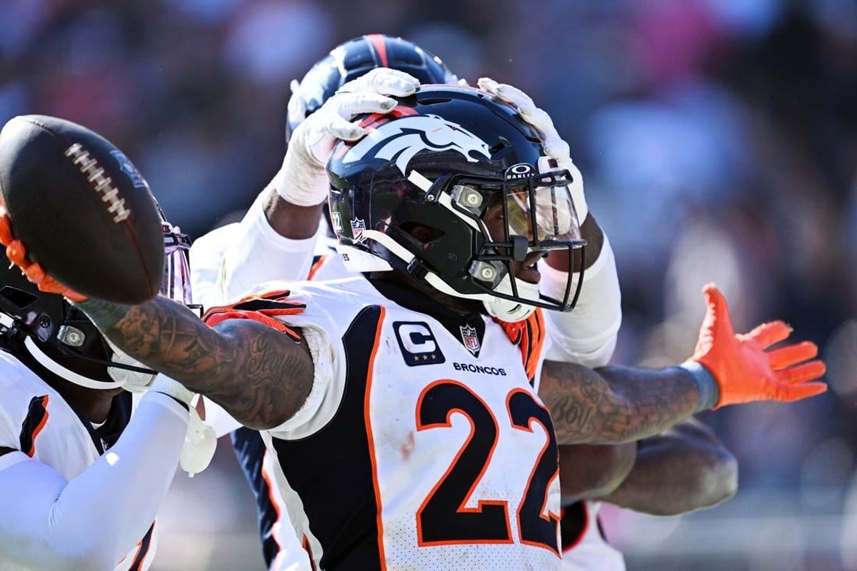 Oct 1, 2023; Chicago, Illinois, USA;  Denver Broncos safety Kareem Jackson (22) celebrates after intercepting a Chicago Bears pass in the fourth quarter at Soldier Field.