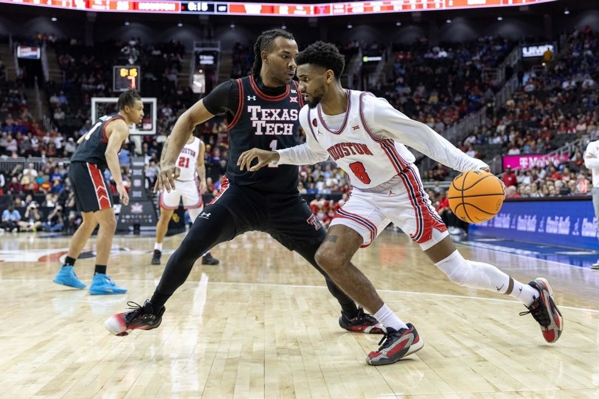Mar 15, 2024; Kansas City, MO, USA; Houston Cougars guard Mylik Wilson (8) drives around Texas Tech Red Raiders guard Lamar Washington (1) during the first half at T-Mobile Center.